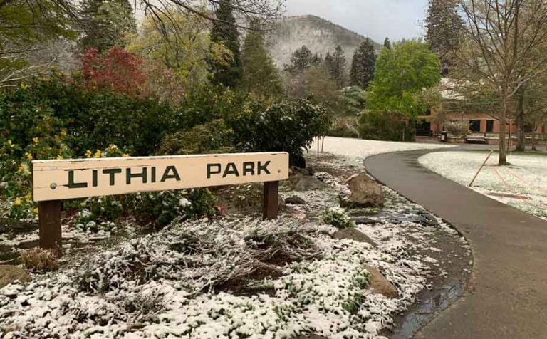 Before: The Lithia Park sign as it appeared about 20 minutes before it was mowed down. Ashland.news photo by Bert Etling