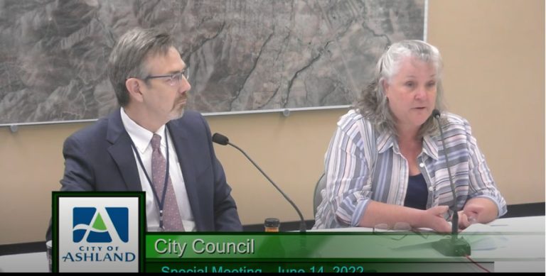 Ashland City Manager Joe Lessard, left, listens to interim Finance Director Alison Chan give a report at a special meeting of the City Council on Tuesday, June 15. Screenshot from RVTV video