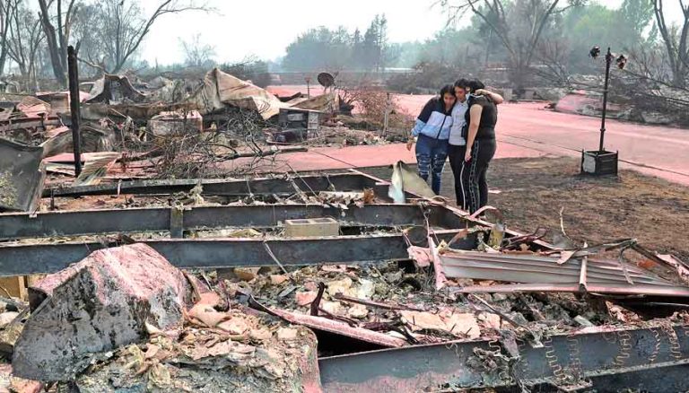 Maria Rico, left, Sofia Rico and Delia Rico say goodbye to their home in Talent following the Almeda Fire in September 2020. Ashland is updating its plan to lower the chances of catastrophic fire in Ashland. Jamie Lusch photo