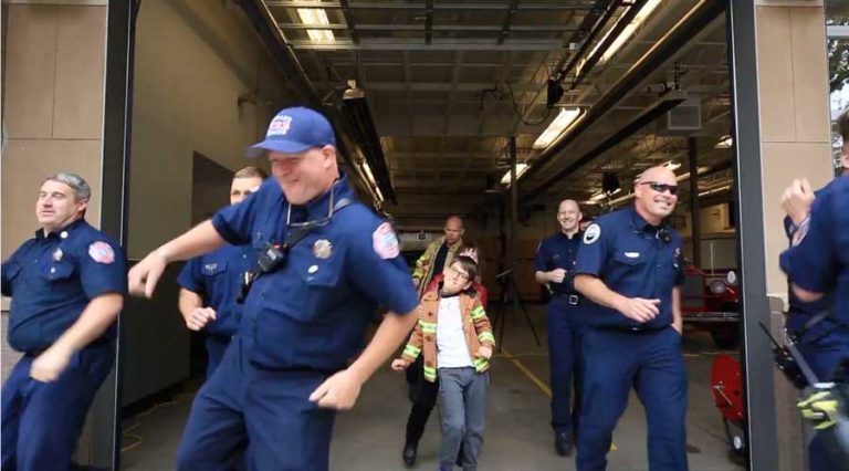 Luke Hogan Laurenson, center, with Ashland Fire & Rescue firefighters in the 2017 YouTube video "'Shake It Off' for Luke."