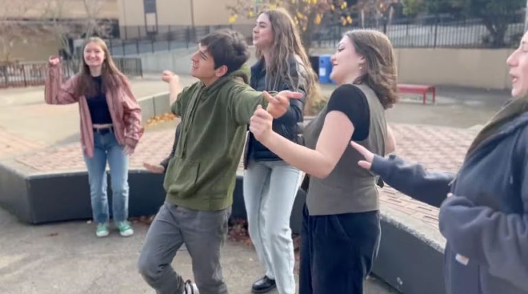 Luke Hogan Laurenson dances with fellow Ashland High School students in the courtyard at Ashland High School in a screen capture from a YouTube video, "Shake It Off for Luke Ashland High School."