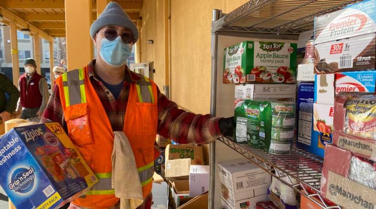 Jason Houk, operations assistant at the Ashland Emergency Food Bank, helps collect food during the final Ashland Food Project drop-off day of 2022 on Dec. 10. Ashland.news photo by Holly Dillemuth