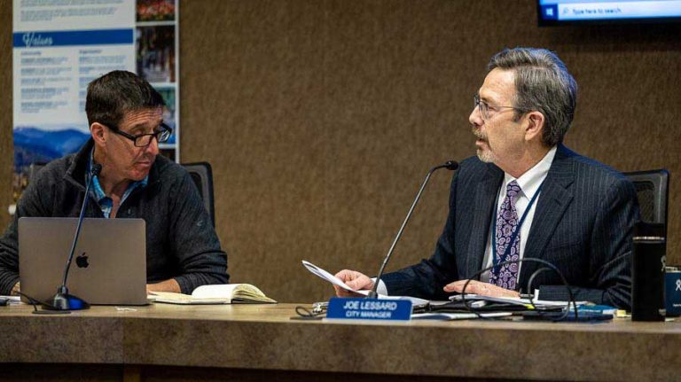 Councilor Eric Hansen, left, listens to City Manager Joe Lessard at a council meeting in February. Bob Palermini photo/palermini.com