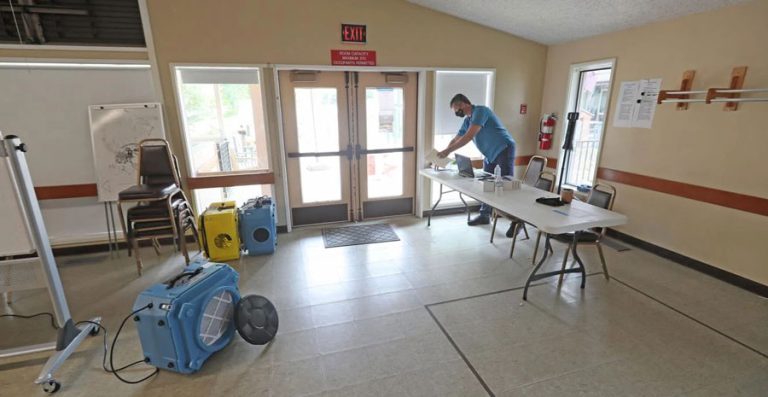 Kelly Burns, emergency manager of the city of Ashland, works Friday at a clean air shelter at the First Presbyterian Church of Ashland. Rogue Valley Times photo by Jamie Lusch