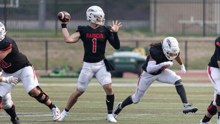 SOU quarterback Matt Struck (1) lines up a pass in the season home opener vs. Willamette. The Raiders won 49-7 with Struck throwing three touchdowns in the second quarter and three more in the third. Bob Palermini photo