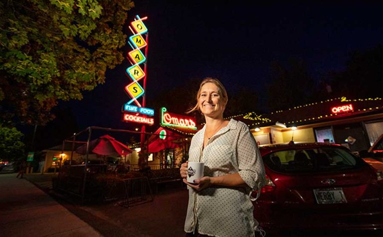 Jennifer Sink in front of Omar's restaurant in Ashland in 2021. Kelly James photo (kellyjamesphoto.com) via saif.com