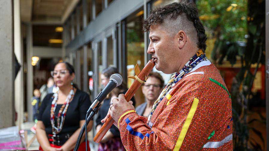 Jesse Jackson, grandson of the first Chief of the Cow Creek Tribe, performed a musical piece as part of the program at the Indigenous Peoples Day celebration on the Southern Oregon University campus. Bob Palermini photo