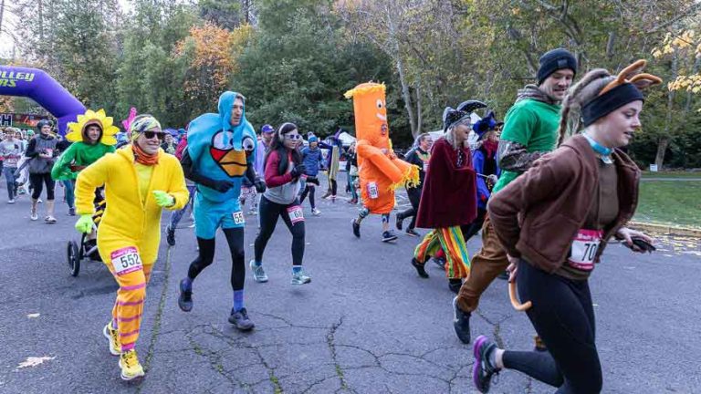 Costumed runners start the 5K and 10K race near the bandshell in Lithia Park Saturday. A record 1,200 runners registered for the runs. Ashland.news photo by Bob Palermini