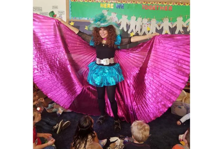 Grandma Boom (Janai Mestrovich) spreads her wings in a classroom during a lesson with children. Courtesy photo Grandma Boom