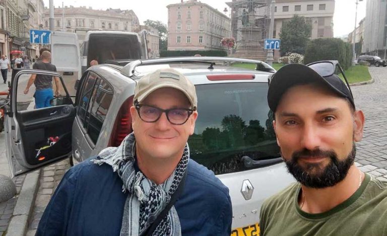 Paul Huard, left, and a Ukrainian colleague in Lviv, Ukraine, prepare to transport medical supplies in August 2023 to a town isolated by the war. Paul Huard photo