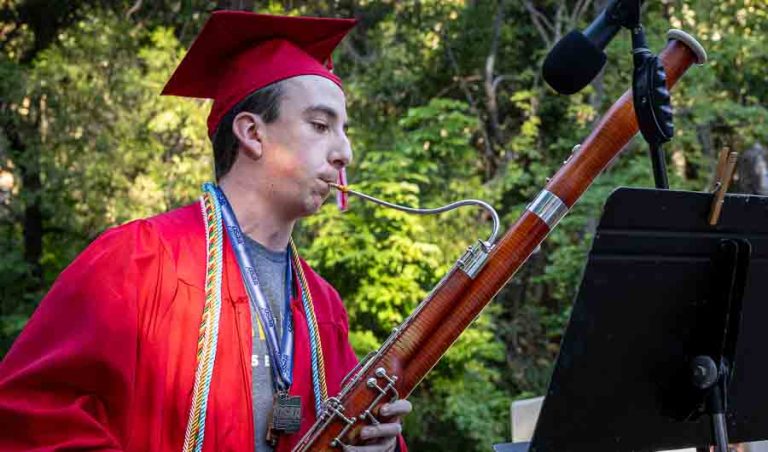 Ashland High School graduate James Dyson performs a bassoon solo on June 6 at his graduation ceremony at Lithia Park. Photo by Bob Palermini