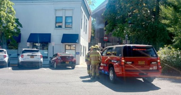 Firefighters talk to Ashland Fire & Rescue Chief Ralph Sartain about Wednesday's power outage. Ashland.news photo by Morgan Rothborne