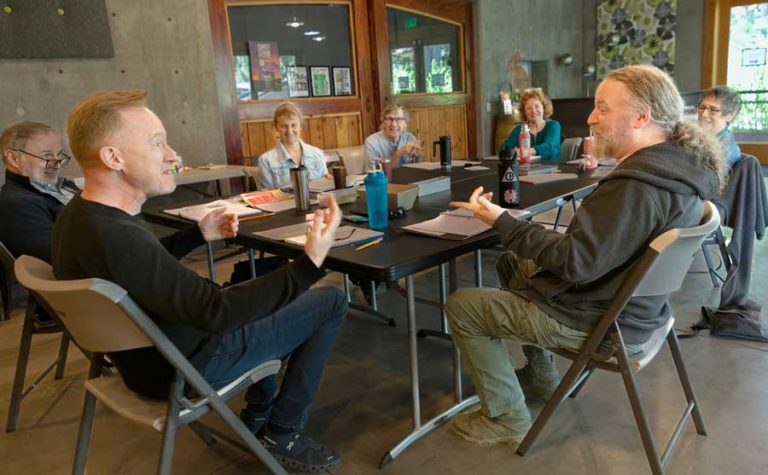 Dan Donohue, left, and Ray Porter participate in a mind-June table read at Grizzly Peak Winery for the Rogue Theater Company production of "Stones in His Pockets," a two-person comedy running July 17 through Aug. 4. Rogue Theater Company photo
