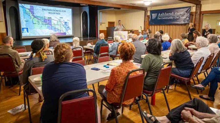 Kelly Burns, Ashland’s emergency management coordinator, spoke to about 70 people at a wildfire preparedness event at the Bellview Grange in August 2024. The event was sponsored by Ashland.news, Ashland Together, Ashland CERT and the city of Ashland. Ashland.news photo by Bob Palermini