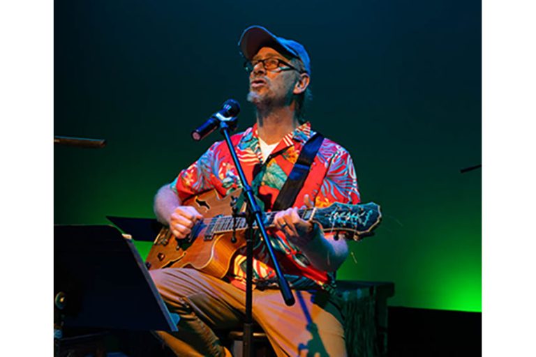 Ashland's Robbie Dacosta performs the songs of Jimmy Buffett at the Camelot Theatre in Talent. Brian O'Connor photo