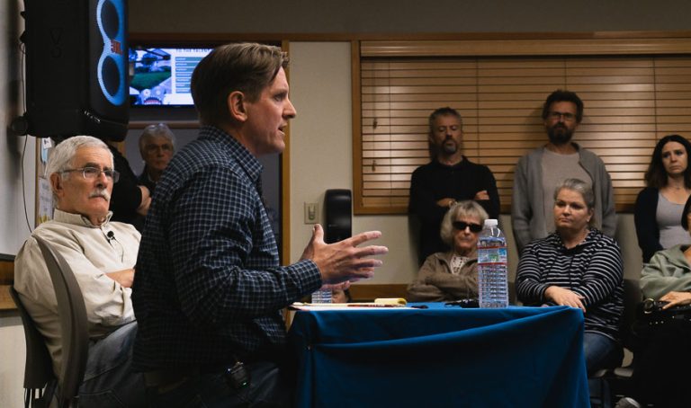 Ryan Flynn, president of Pacific Power, answers a question Wednesday as state Sen. Jeff Golden, at left, looks on. Lucas Adelman photo for Ashland.news