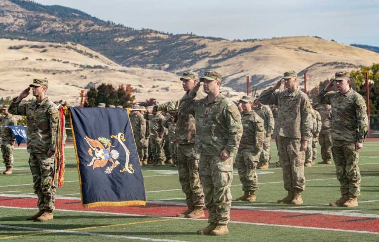 Oregon Army National Guard Soldiers assigned to the 1st Battalion, 186th Infantry Regiment, render a hand salute during the playing of the National Anthem as they take part in their formal mobilization ceremony. National Guard photo by John Hughel, Oregon Military Department Public Affairs