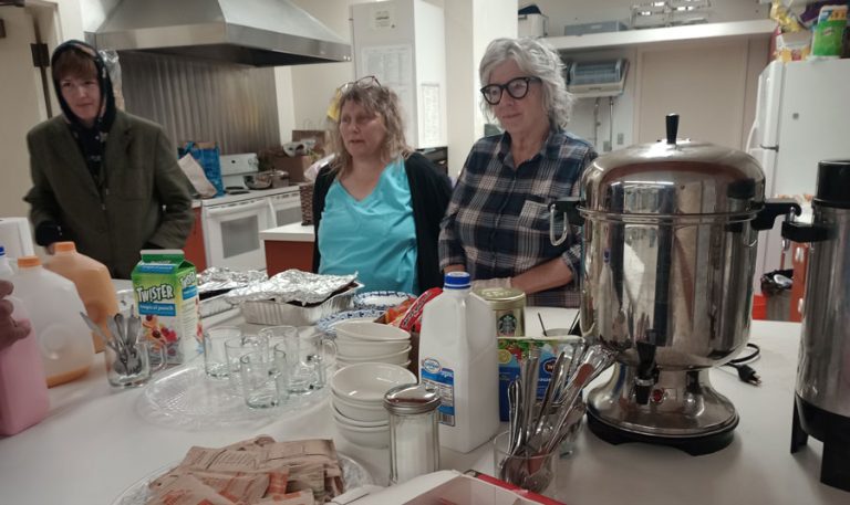 Volunteers serve breakfast: from left, James Fox-Bride, Vanessa Houk and Ruby Nichols. Ashland.news photo by Morgan Rothborne