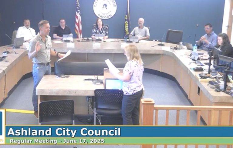 Councilor Derek Sherrell takes the oath of office at Tuesday's council meeting. Screen capture from RVTV video