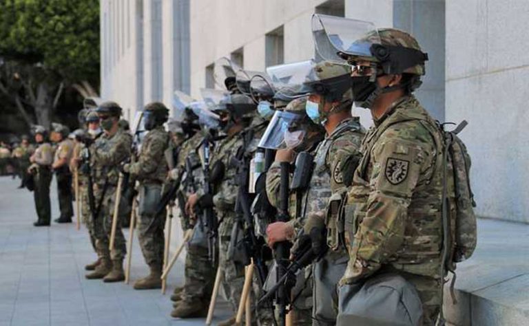 U.S. Soldiers of the 224th Sustainment Brigade, California Army National Guard, stand in front of the Hall of Justice in Los Angeles, June 3, 2020. Cal Guard Soldiers and Airmen were tasked to assist law enforcement in maintaining peace and calm during protests in downtown Los Angeles. U.S. Army National Guard photo by Staff Sgt. Matthew Ramelb