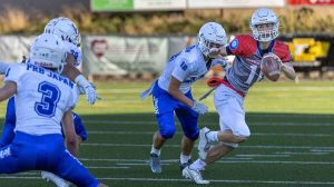 A South Valley Wolfpack player evades a Japan All-Star during the Pacific Rim Bowl on Friday, July 25, at Ashland High School. The Japan All-Stars won the exhibition game 49-0. Ashland.news photo by Bob Palermini.
