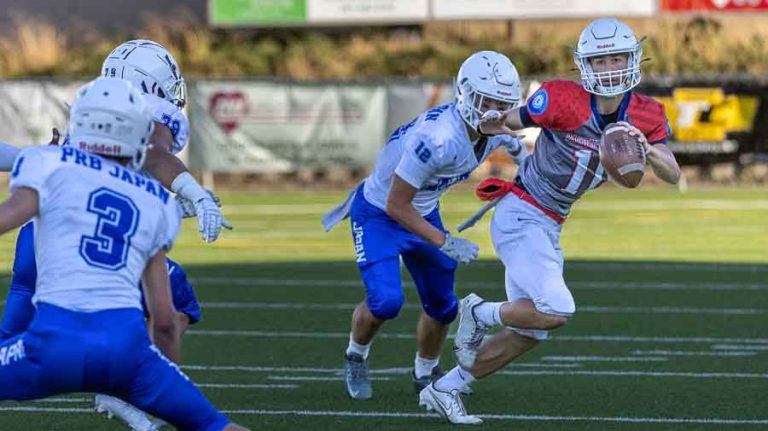 A South Valley Wolfpack player evades a Japan All-Star during the Pacific Rim Bowl on Friday, July 25, at Ashland High School. The Japan All-Stars won the exhibition game 49-0. Ashland.news photo by Bob Palermini.