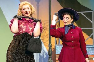 Stephanie C. Jones, left, and Lyndsay Nashington perform in "Guys and Dolls" at the Camelot Theatre in Talent. Jones portrays dancer Miss Adelaide. Nashington plays Sister Sara Brown. Photo by Brian O'Connor