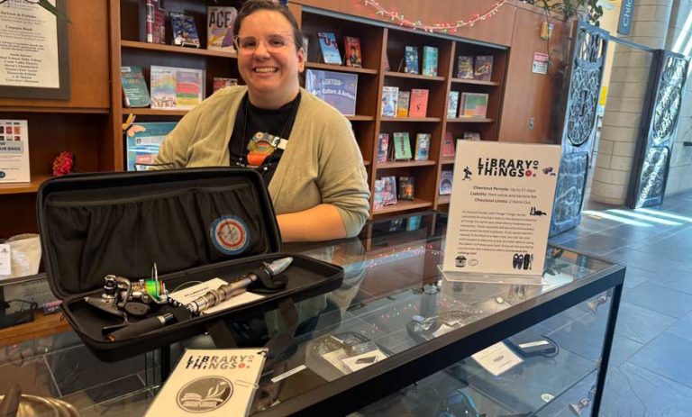 Laurin Arnold, collection development manager for Jackson County Library Services, showcases a fly fishing rod available for check out through the Library of Things. The program delivers items to all JCLS branches, including Ashland. Ashland.news photo by Holly Dillemuth