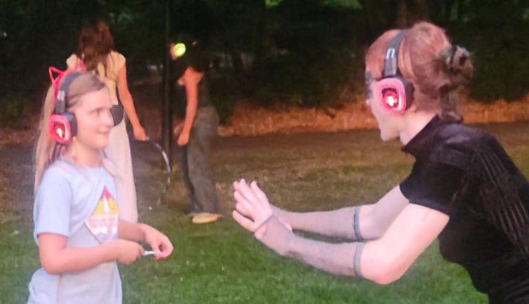 Aurora, an event organizer, interacts with a participant at the Silent Disco Showdown at Lithia Park on Aug. 1. Another Artnow event at the park is set for Friday, Aug. 15. Art Van Kraft photo for Ashland.news