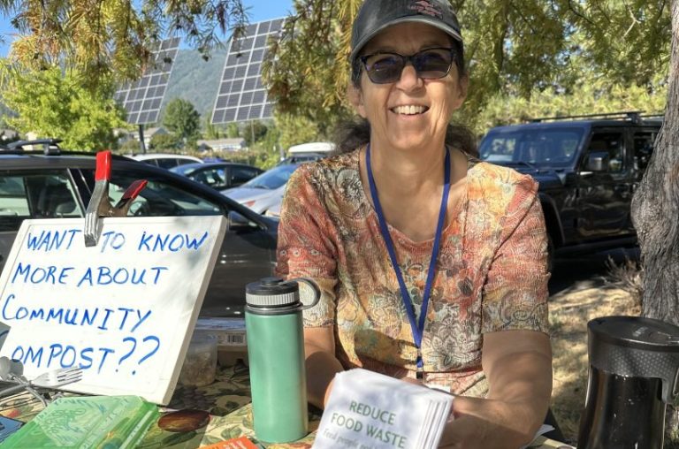Flavia Franco, a Southern Oregon Food Solutions volunteer, tables at a composting event. Photo courtesy of Flavia Franco