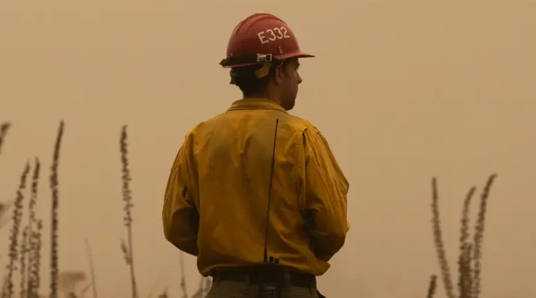 A firefighter surveys wildfire damage in Glen Avon, Oregon, in 2020, the state’s most destructive fire season on record. Nathan Howard photo for Getty Images